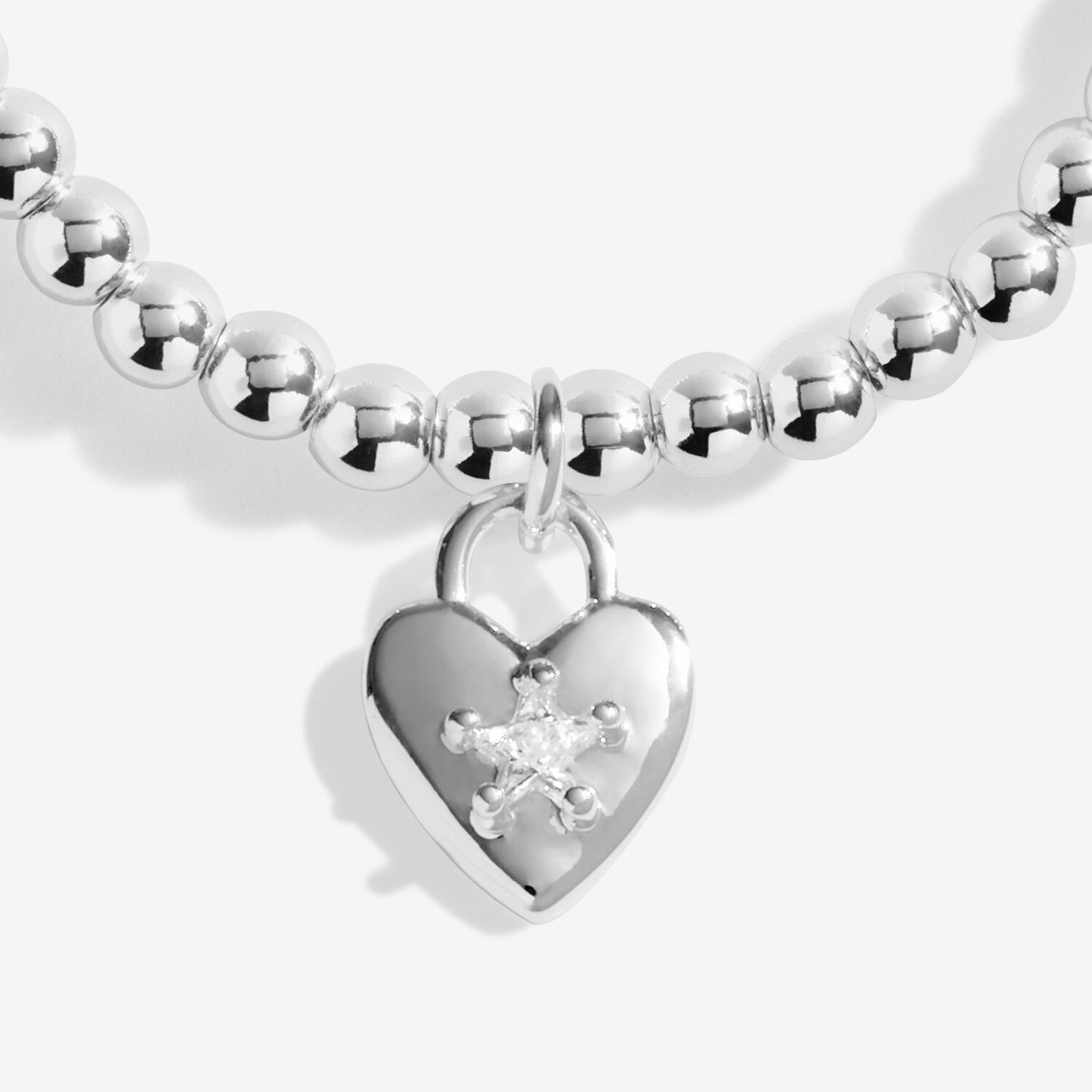 Silver beaded bracelet with a heart-shaped padlock charm on a white background