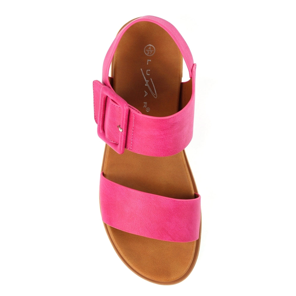 Pink sandal with brown sole on a white background