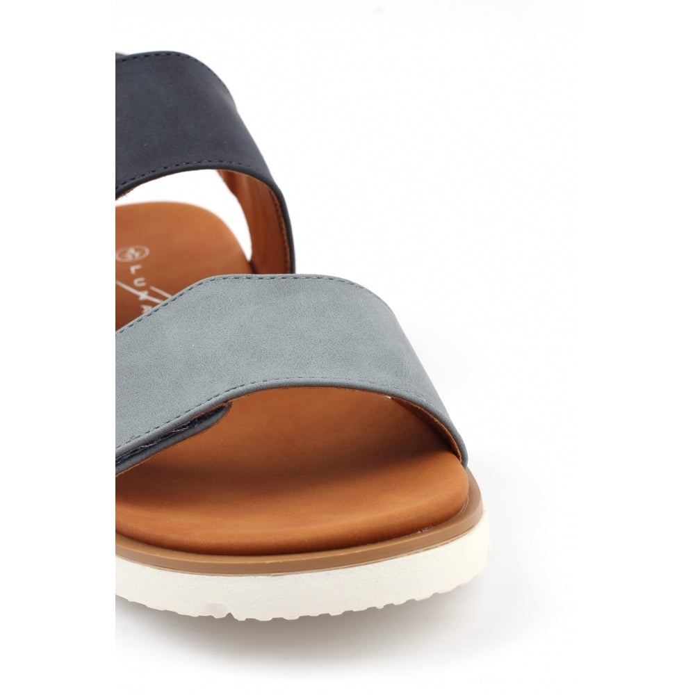 Gray sandal with brown sole on a white background