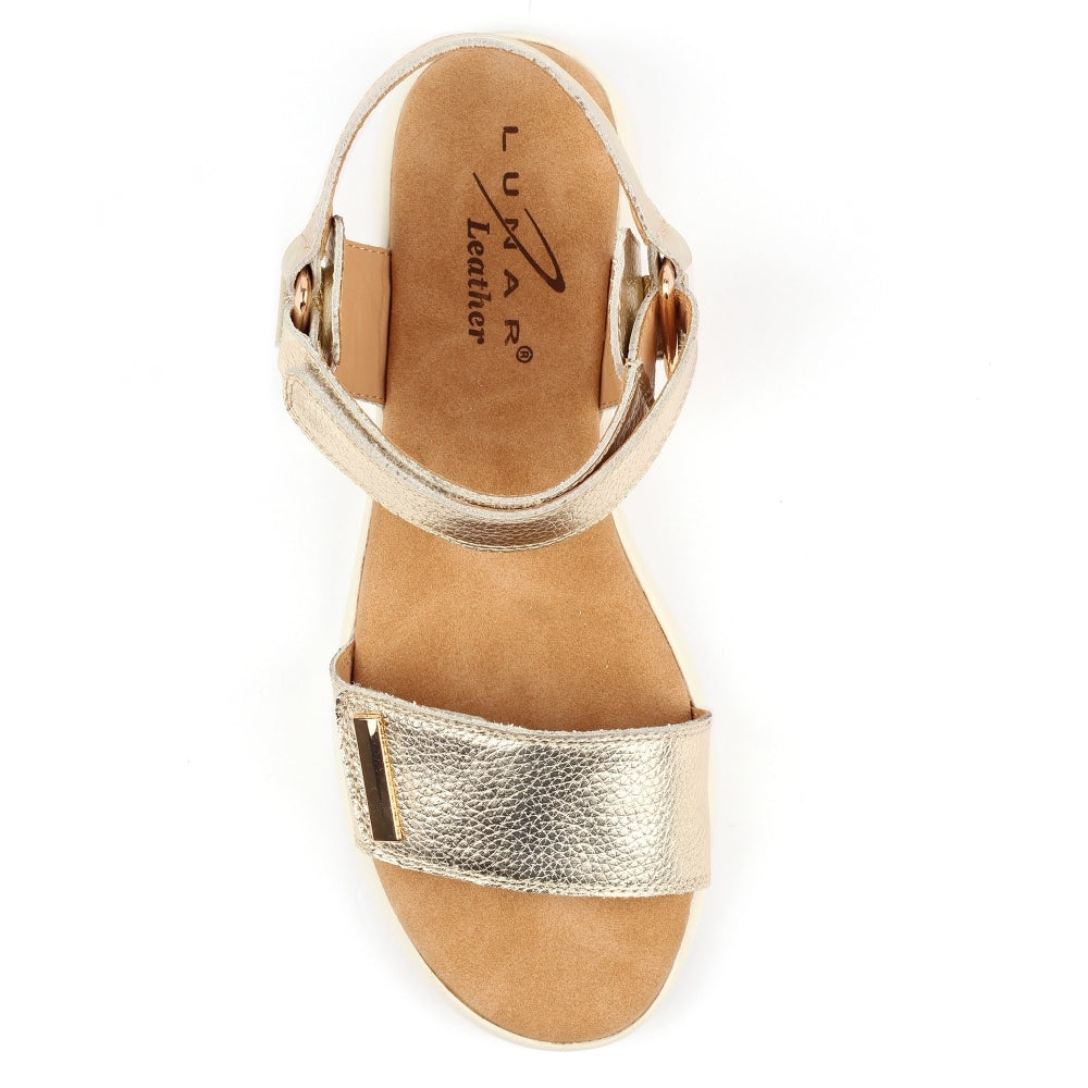 Gold sandal with 'Lux Leather' branding on a white background