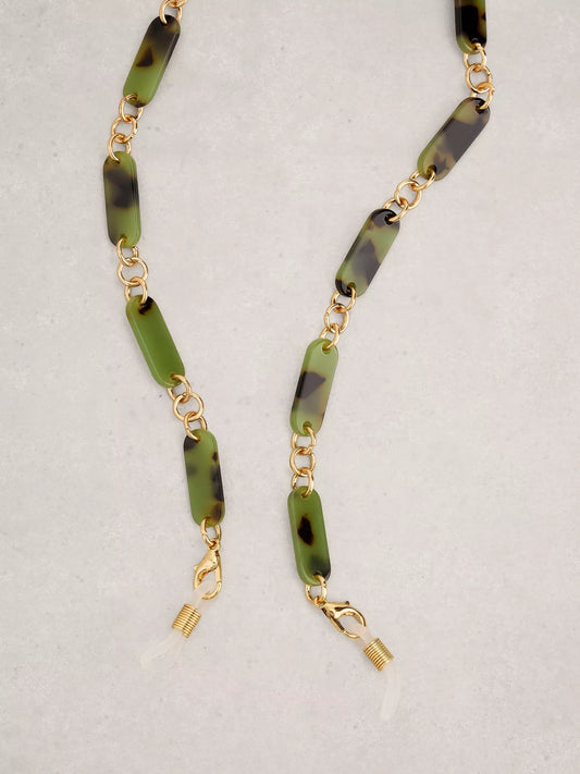 Necklace with green and black beaded chain on a light gray background