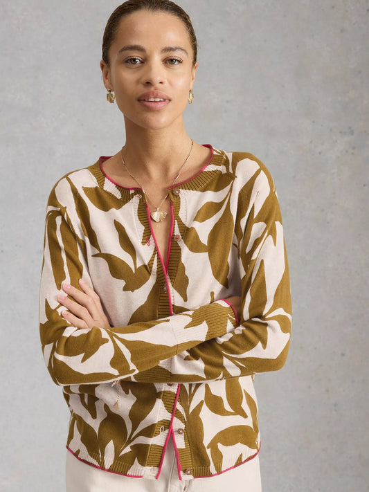 Woman wearing a patterned sweater with a neutral background