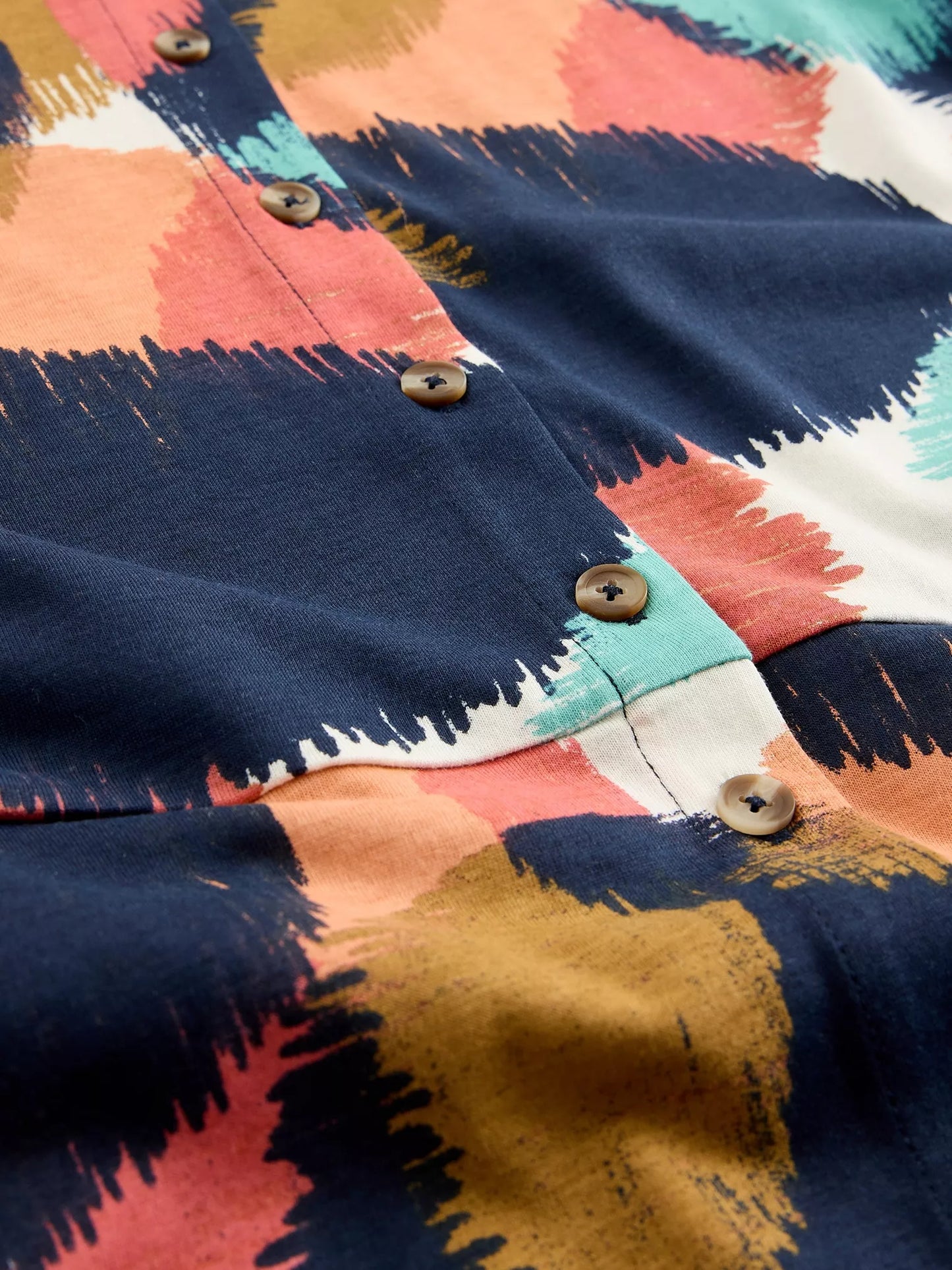 Close up of shirt dress showing tortoiseshell buttons
