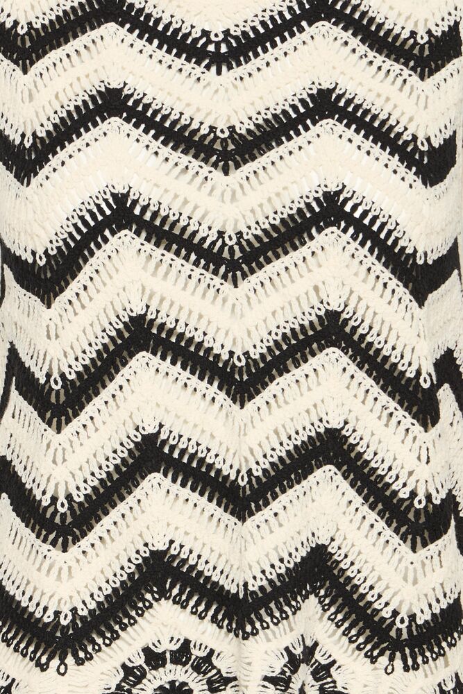 Close-up of a black and white zigzag pattern fabric texture.
