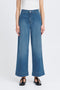 Person wearing blue wide-leg jeans on a white background