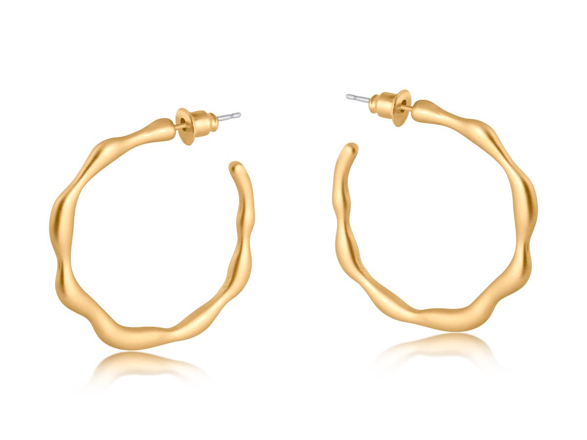 Gold hoop earrings on a white background
