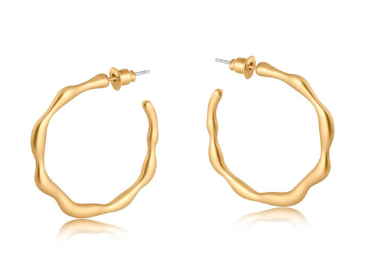 Gold hoop earrings on a white background