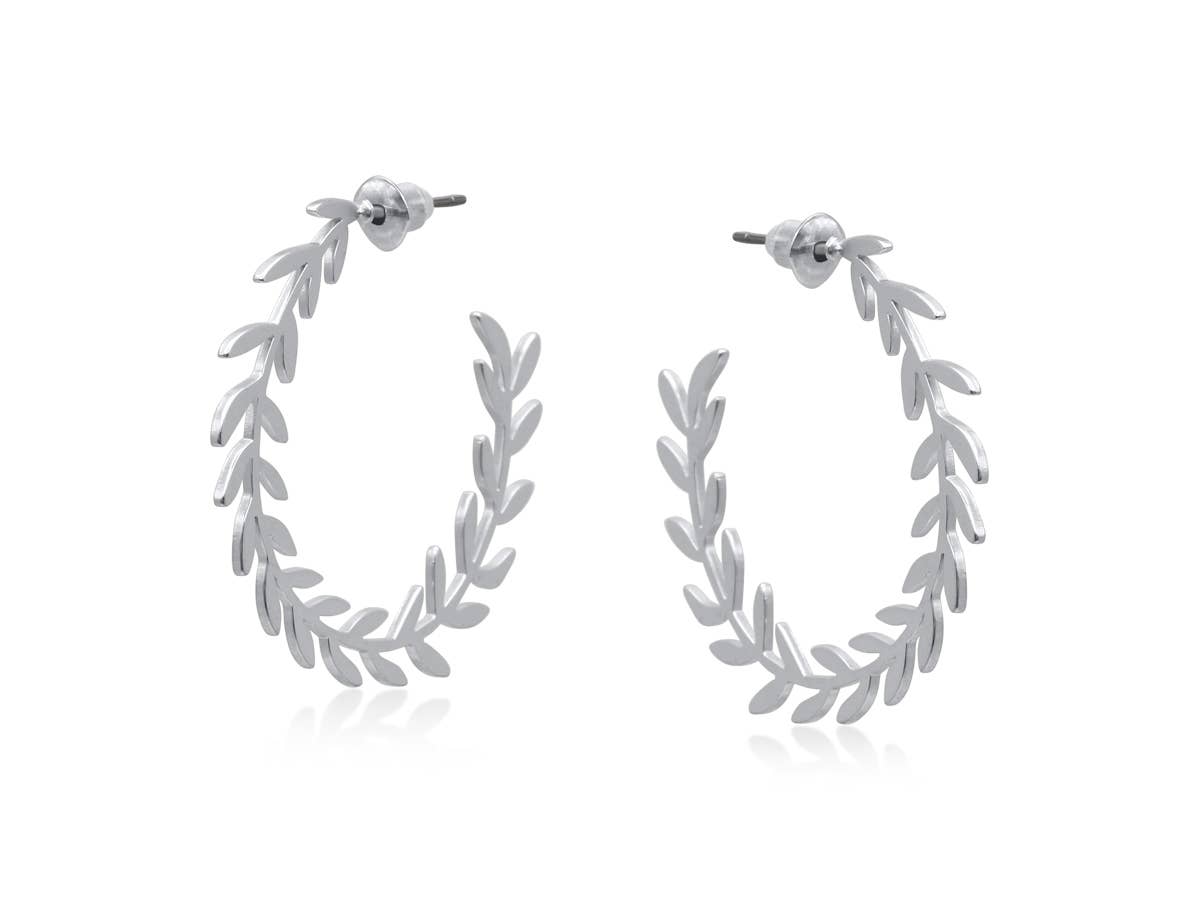 Silver leaf hoop earrings on a white background