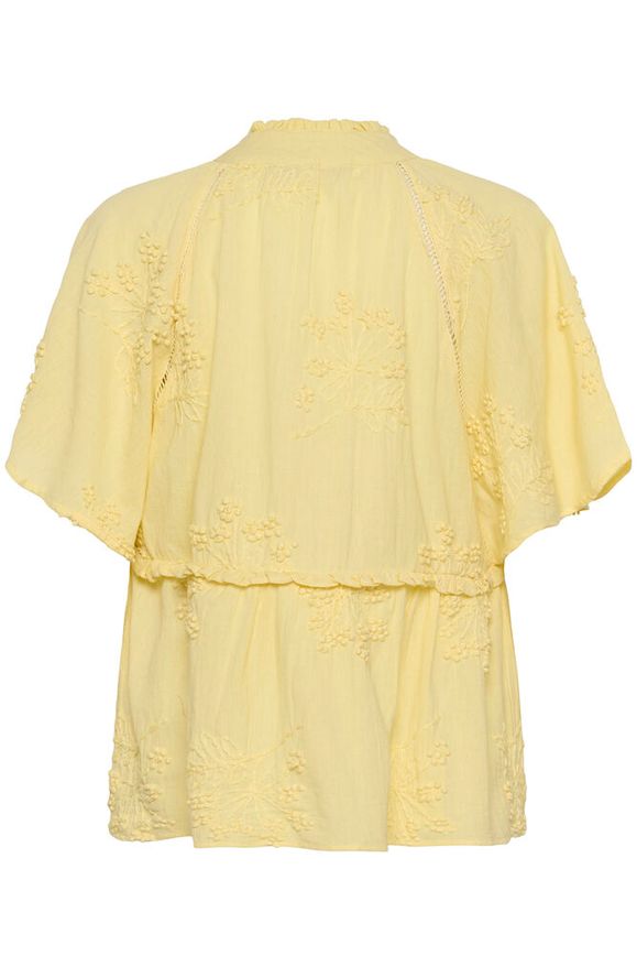 Yellow lace top on a white background