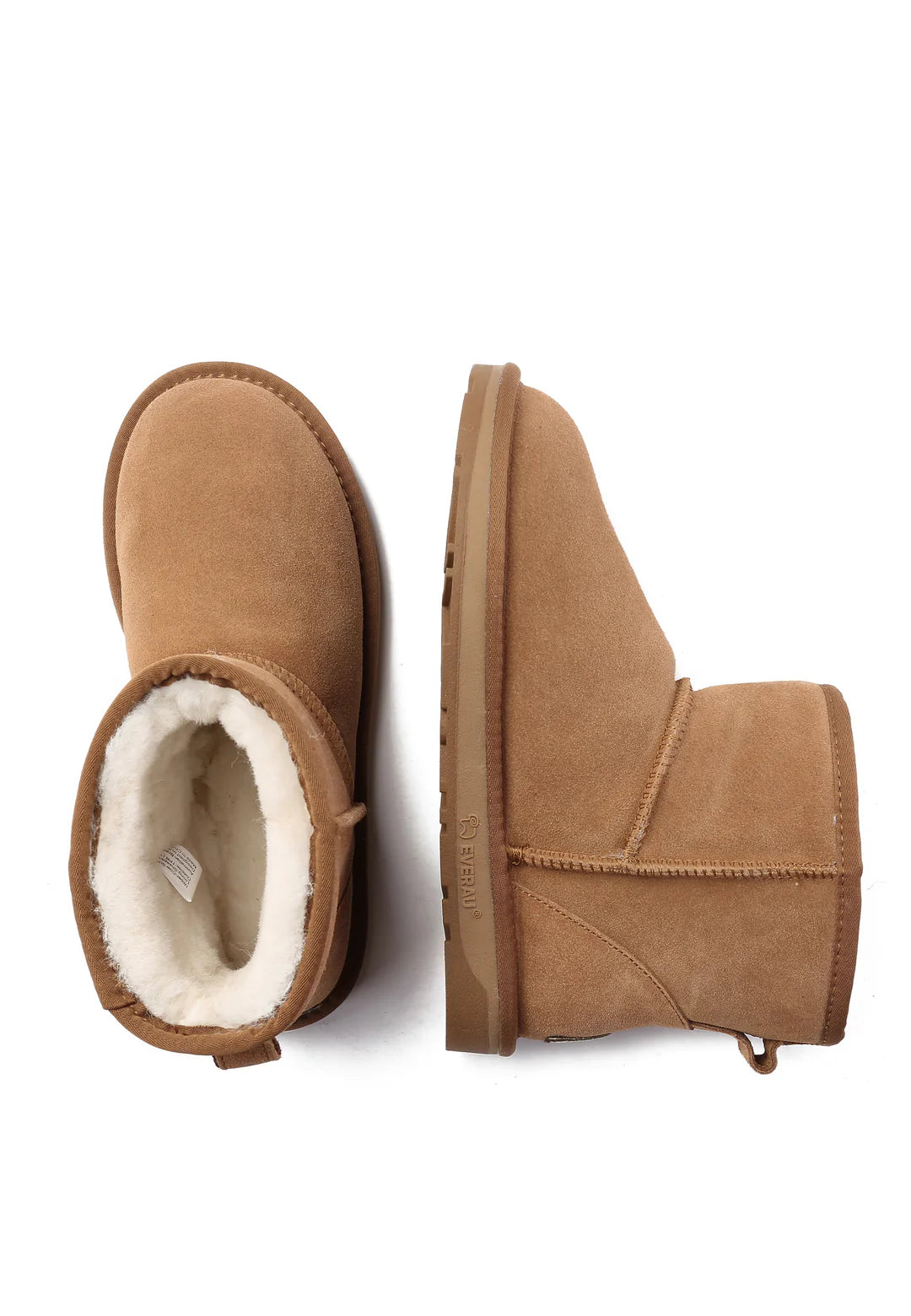 Pair of brown suede boots with white fur lining on a white background
