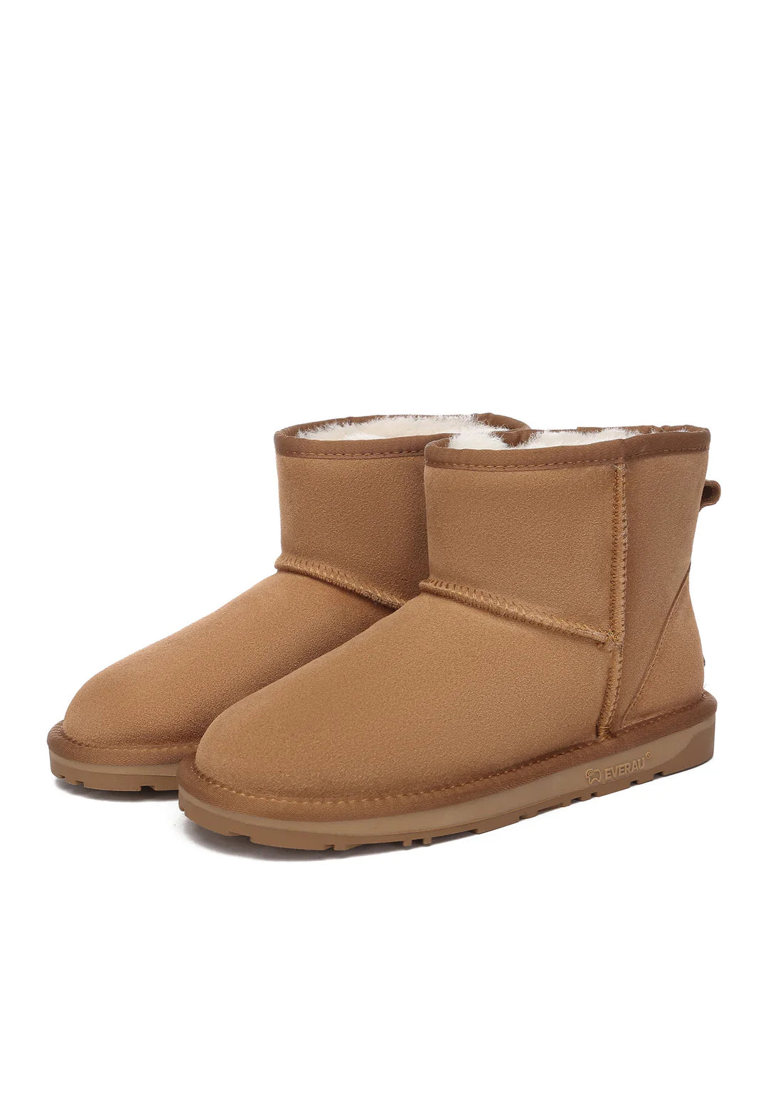 Pair of tan sheepskin boots on a white background