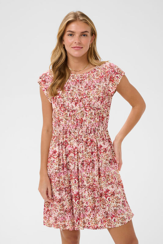 Woman wearing a floral dress on a white background