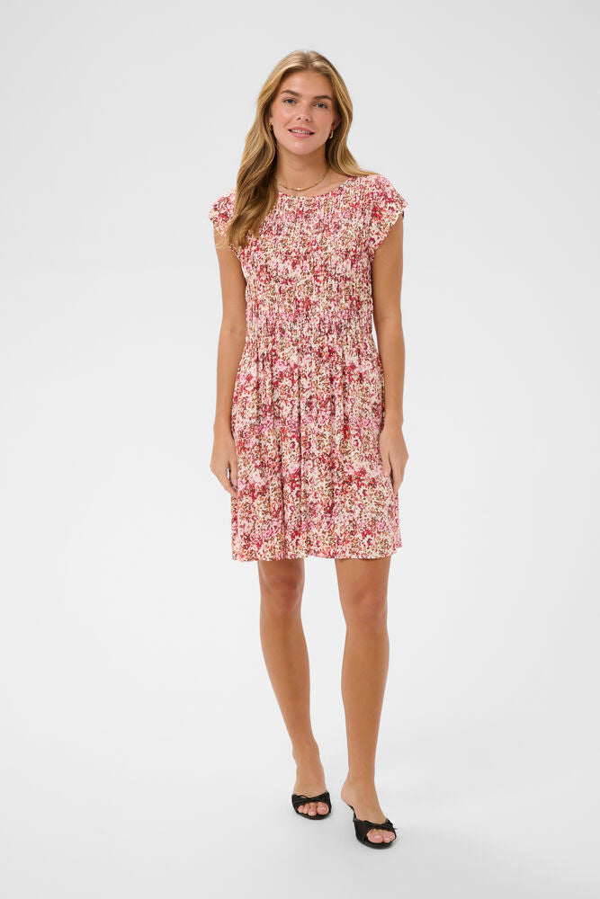 Woman wearing a floral dress on a white background