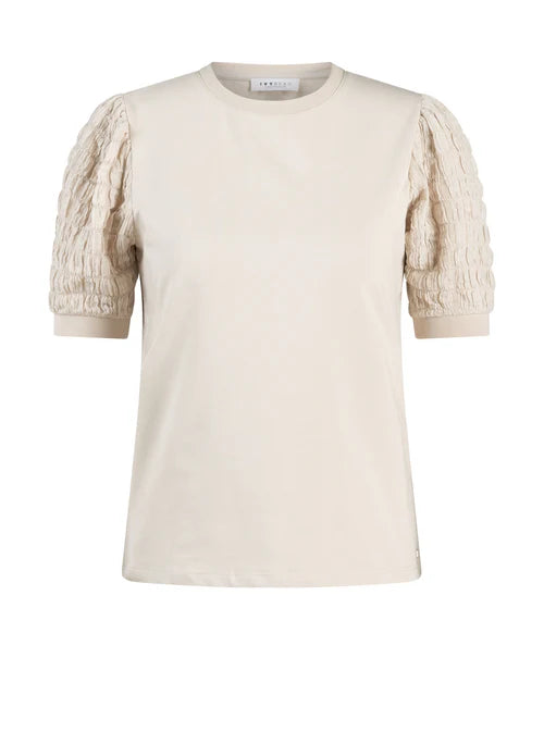 A cream-colored short-sleeve top with textured, ruched puff sleeves, shown against a plain white background.