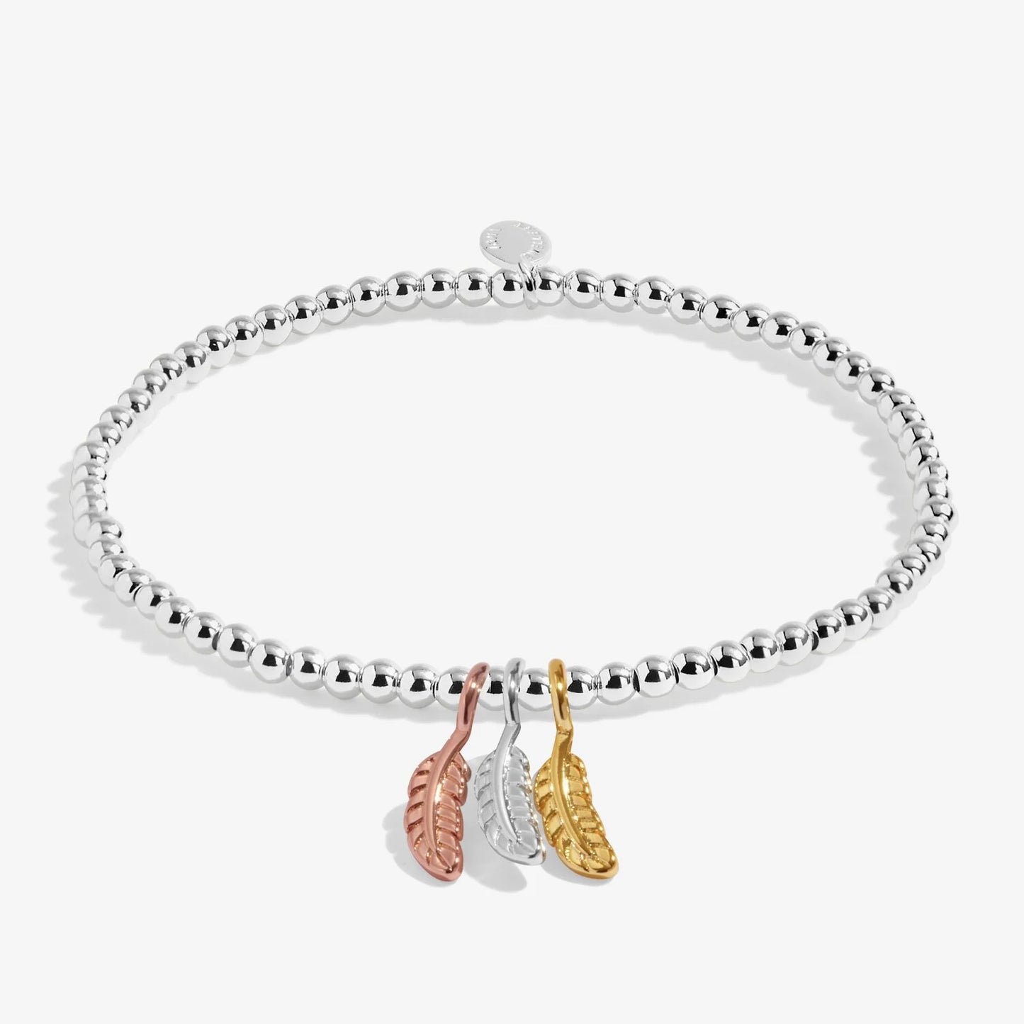 Silver bracelet with three leaf-shaped charms on a white background