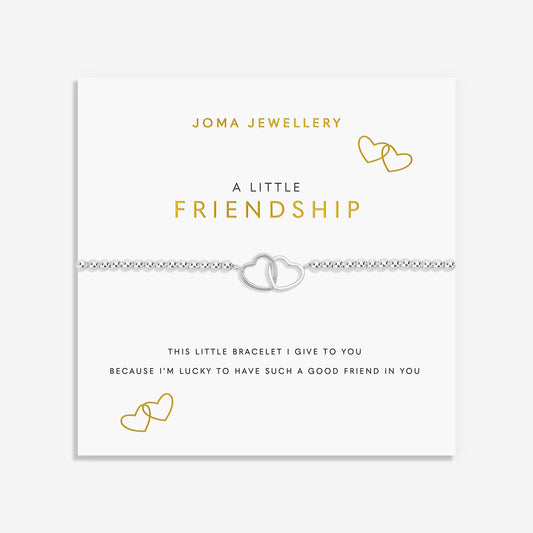 A silver double heart bracelet on a delicate chain, presented on a white card from Joma Jewellery with gold and black text and heart illustrations.