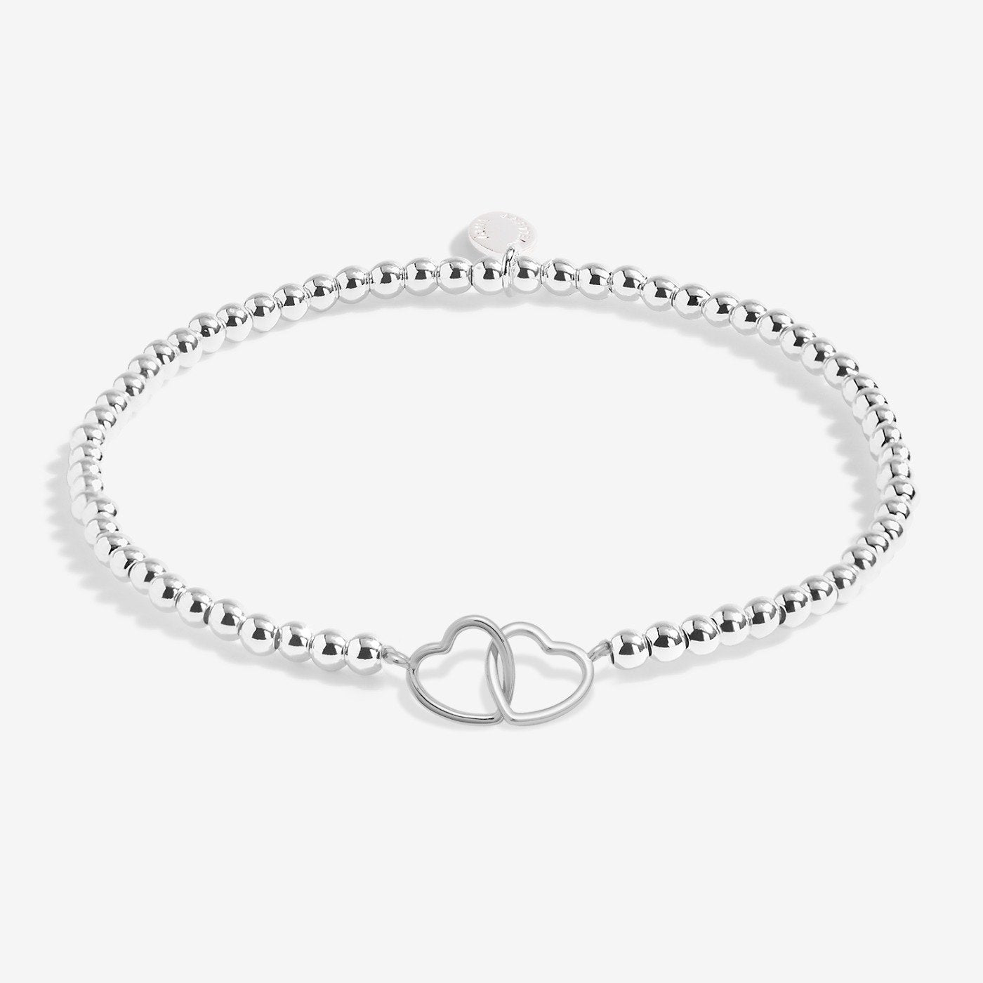 Silver bracelet with a star charm on a white background