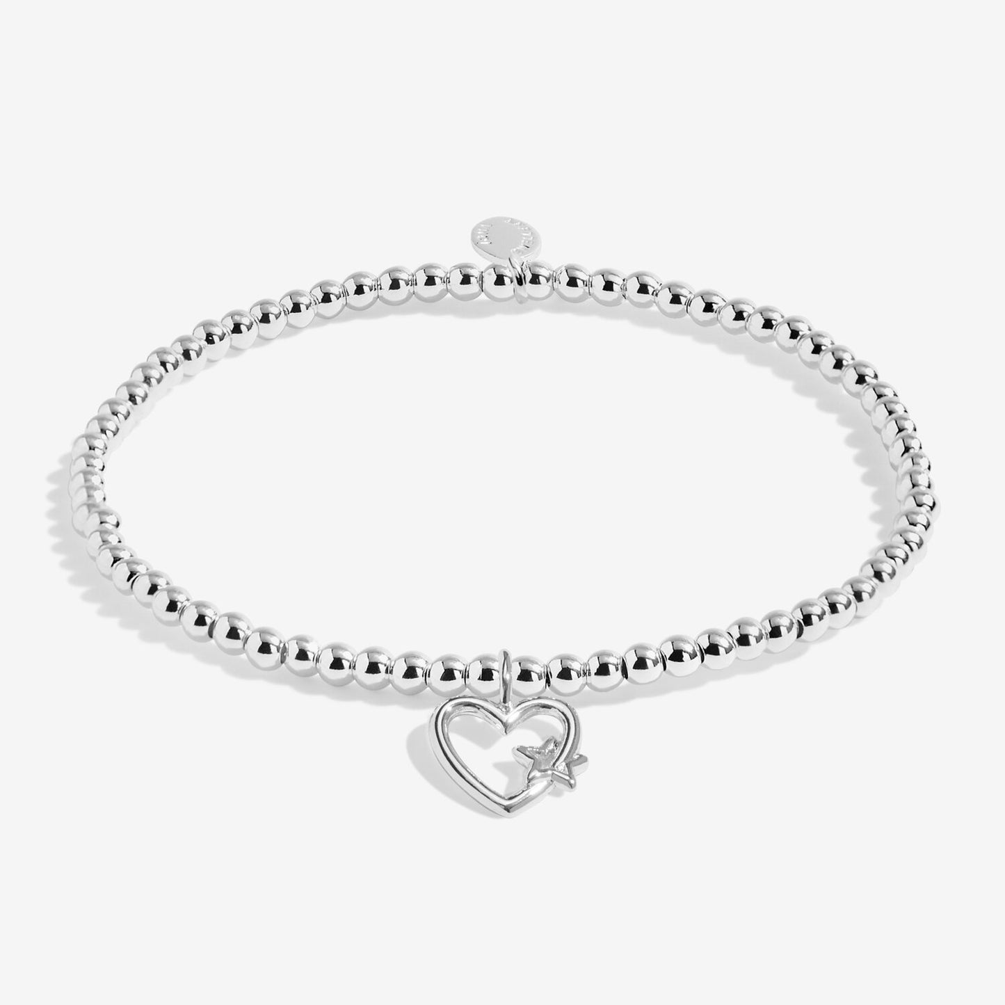 Silver bracelet with a heart-shaped charm on a white background