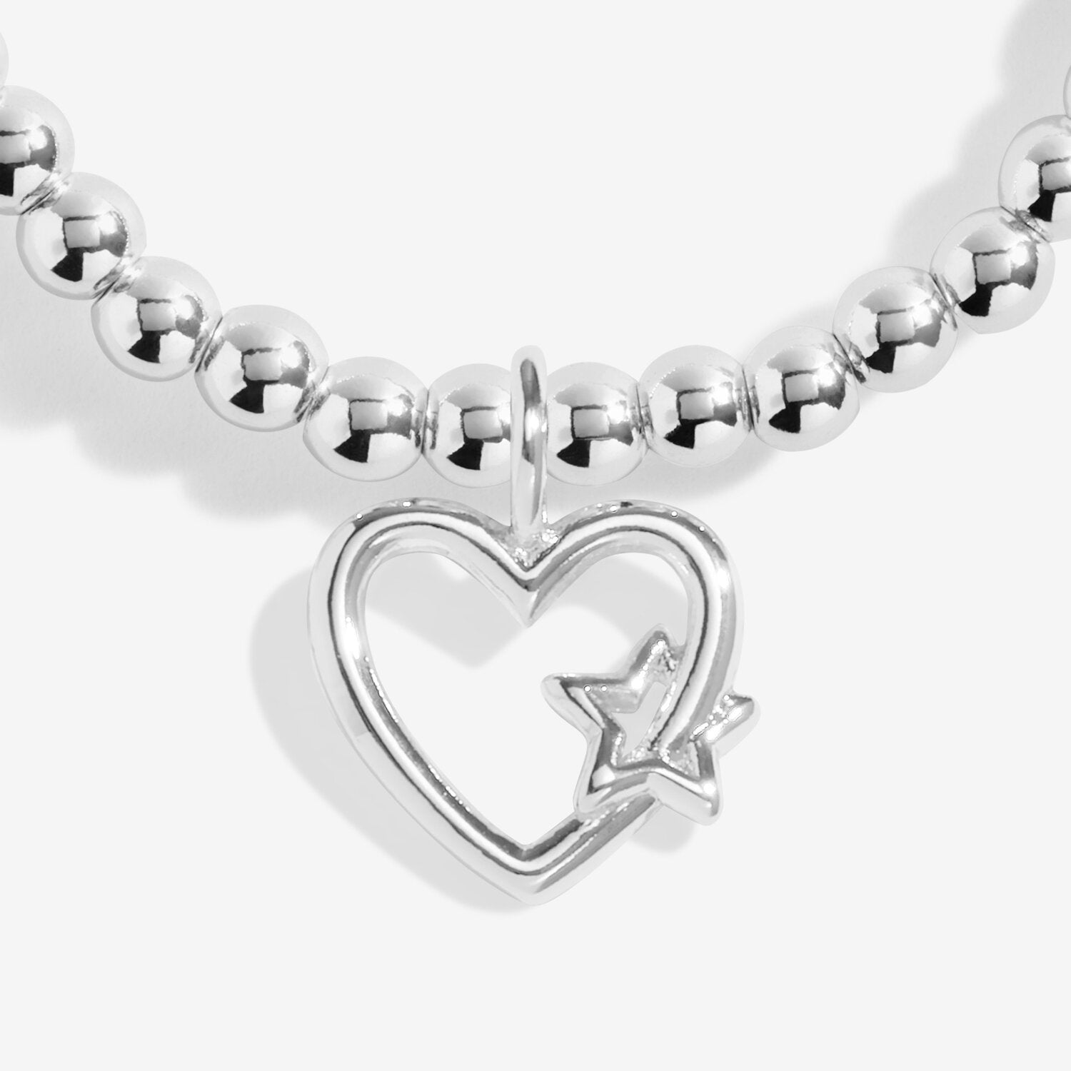 Silver beaded bracelet with a heart-shaped charm featuring a star on a white background