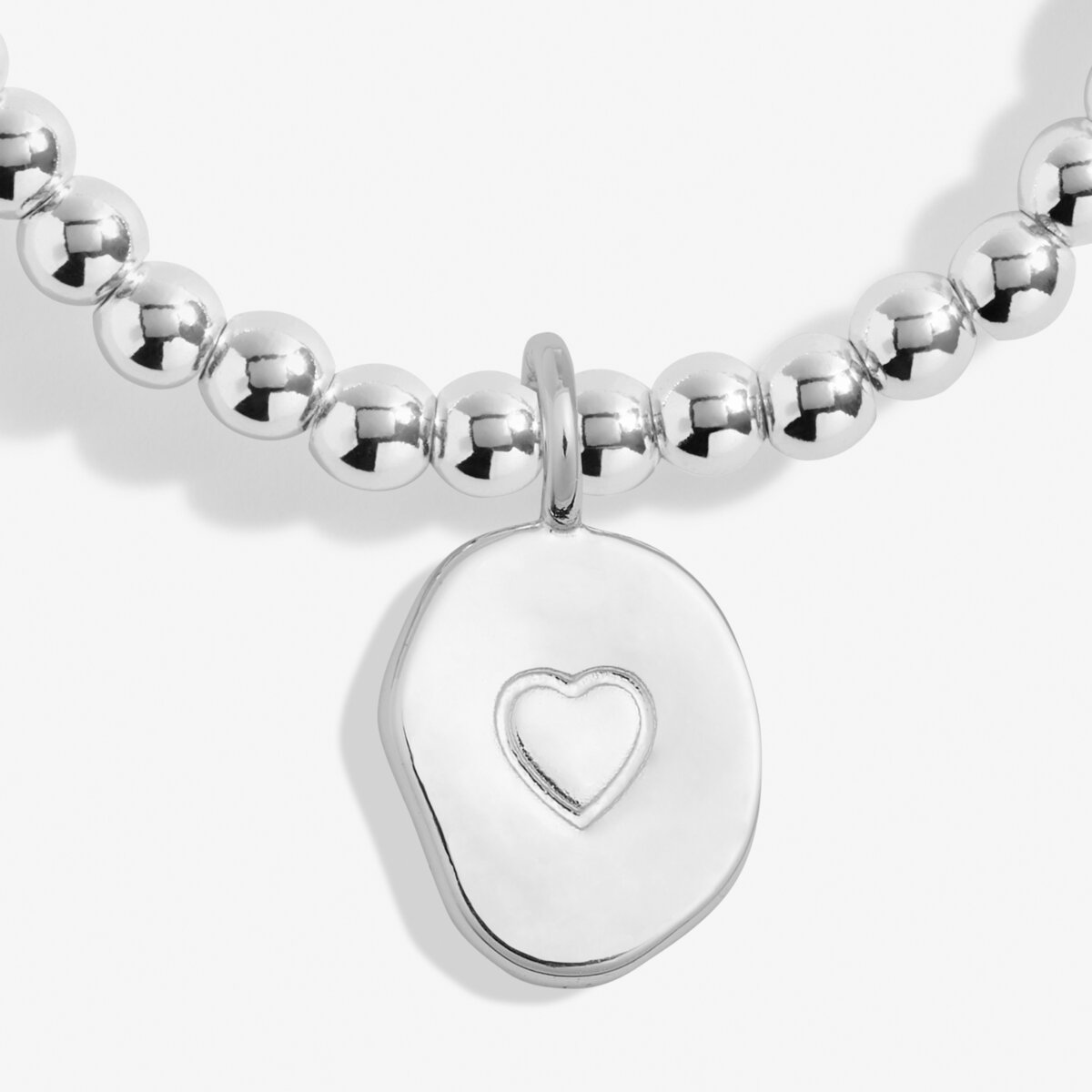 Silver beaded bracelet with a heart-shaped tag on a white background