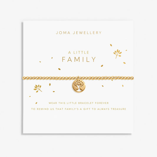 Gold bracelet with tree of life charm on a Joma Jewellery card.