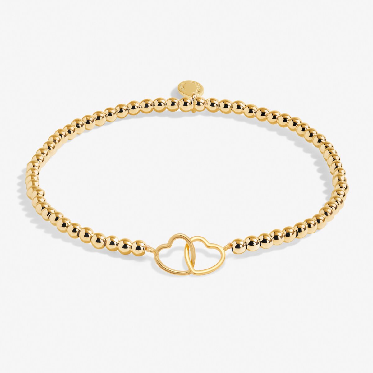 Gold bracelet with a heart-shaped clasp on a white background