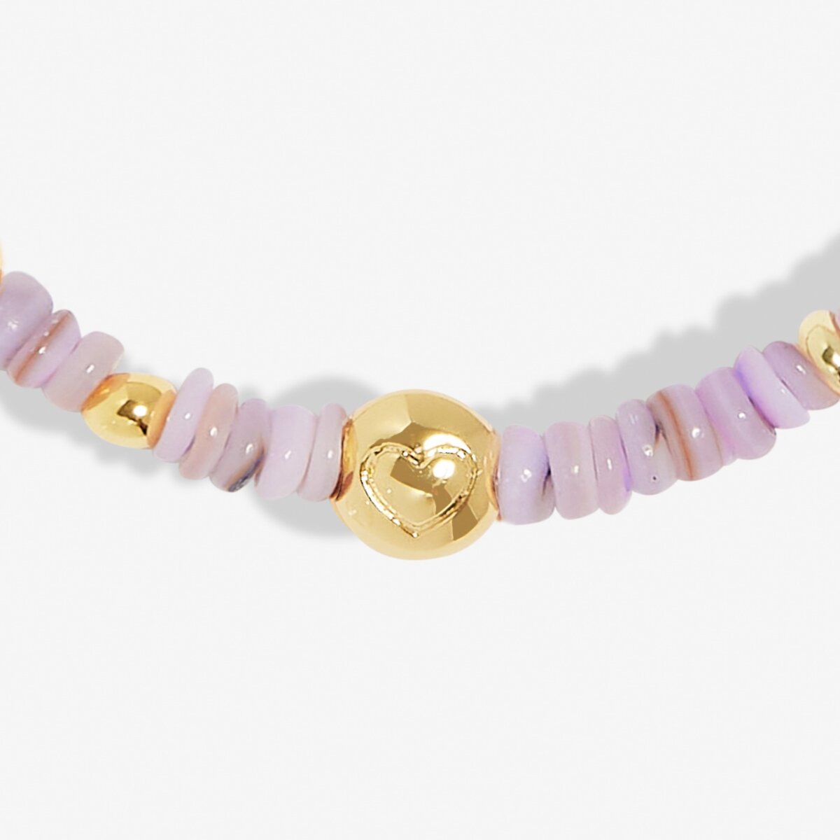 Necklace with pink beads and a gold heart-shaped clasp on a white background