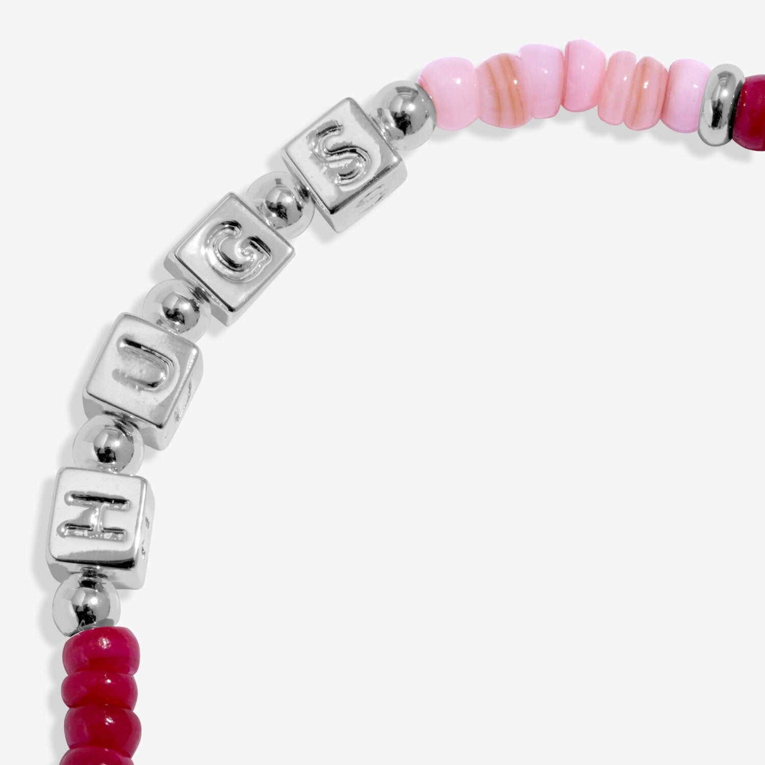 Bracelet with pink and red beads and silver square charms on a white background