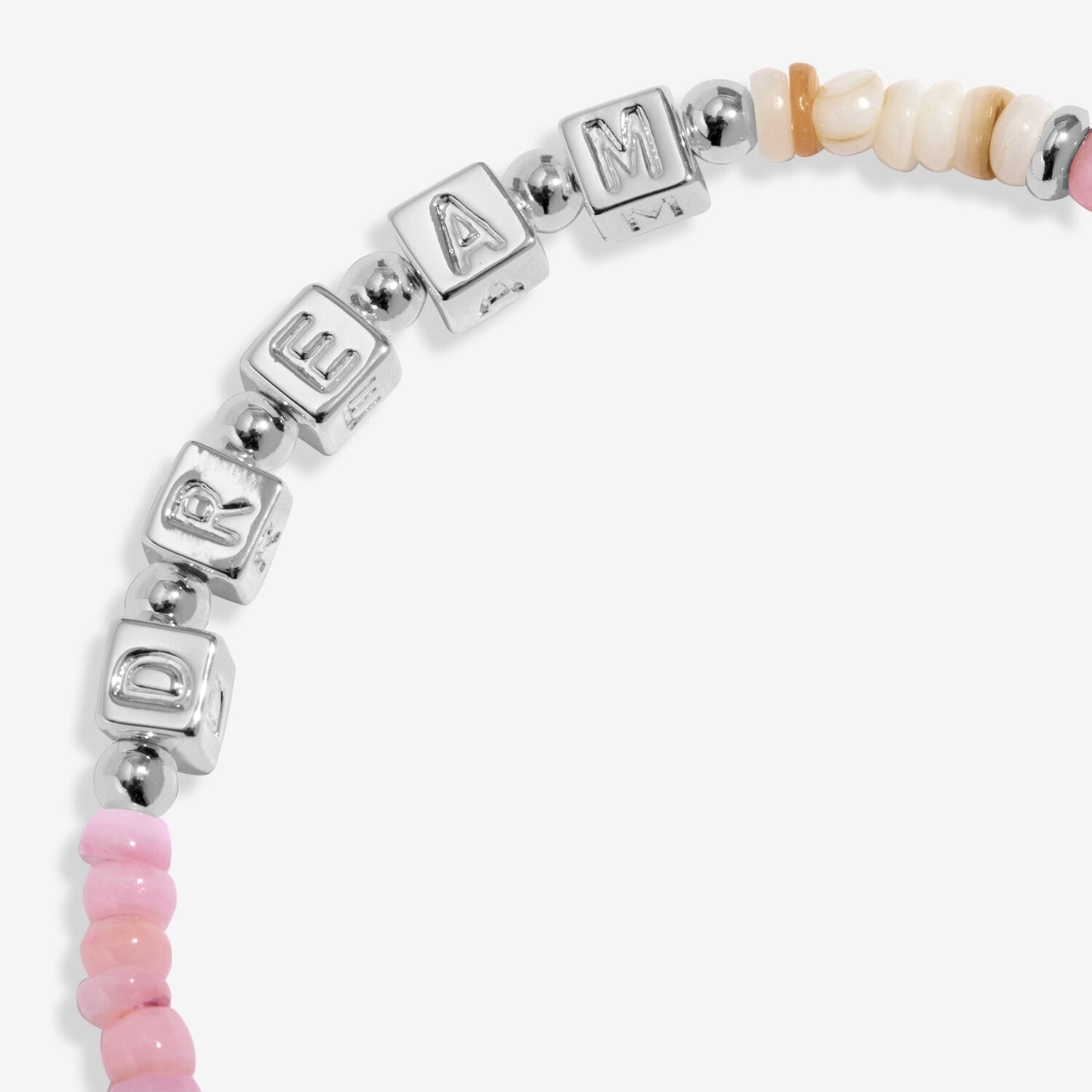 Bracelet with silver beads spelling 'DREAM' and pink beads on a white background