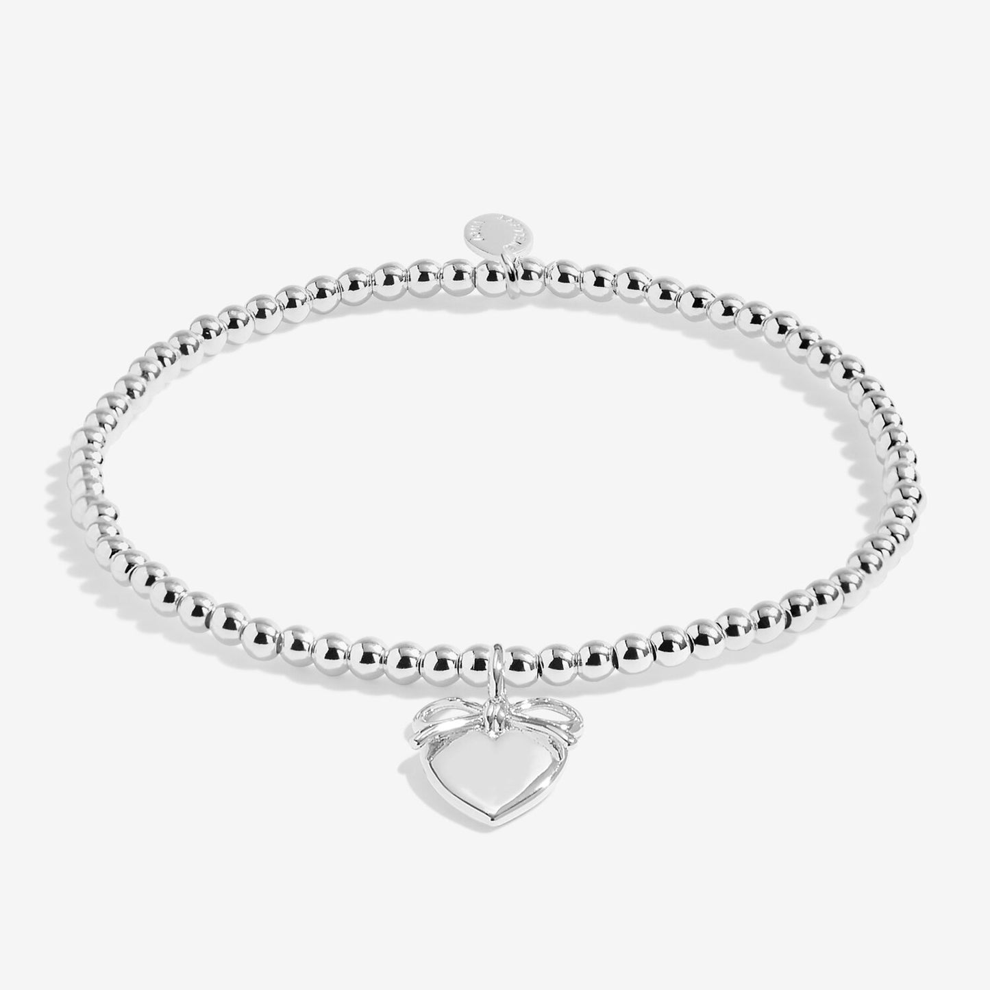 Silver beaded bracelet with a heart-shaped tag on a white background