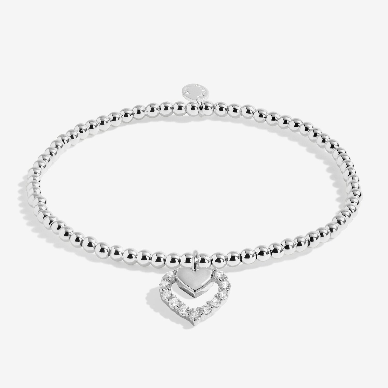 Silver bracelet with a heart-shaped clasp on a white background