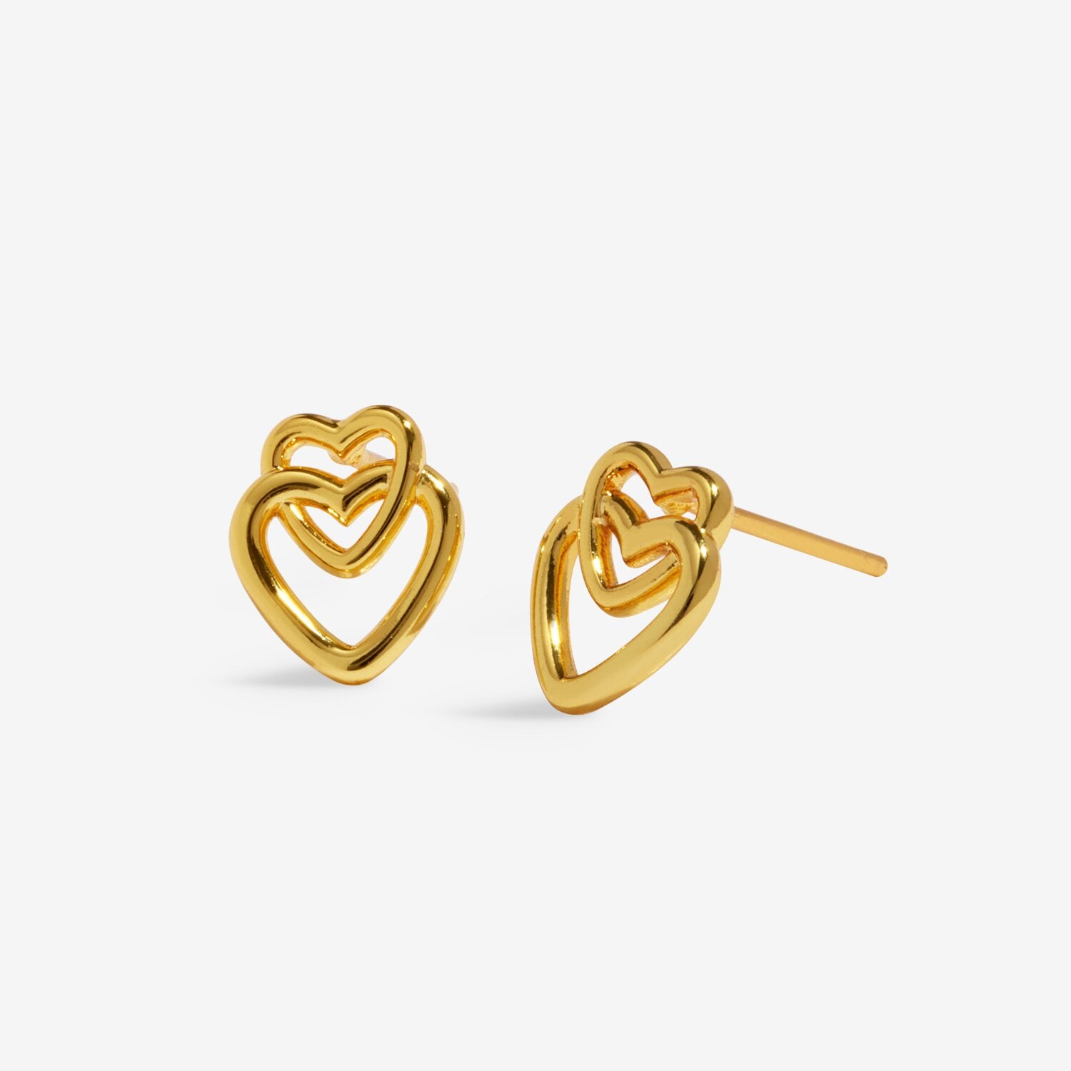 Gold heart-shaped earrings on a light gray background