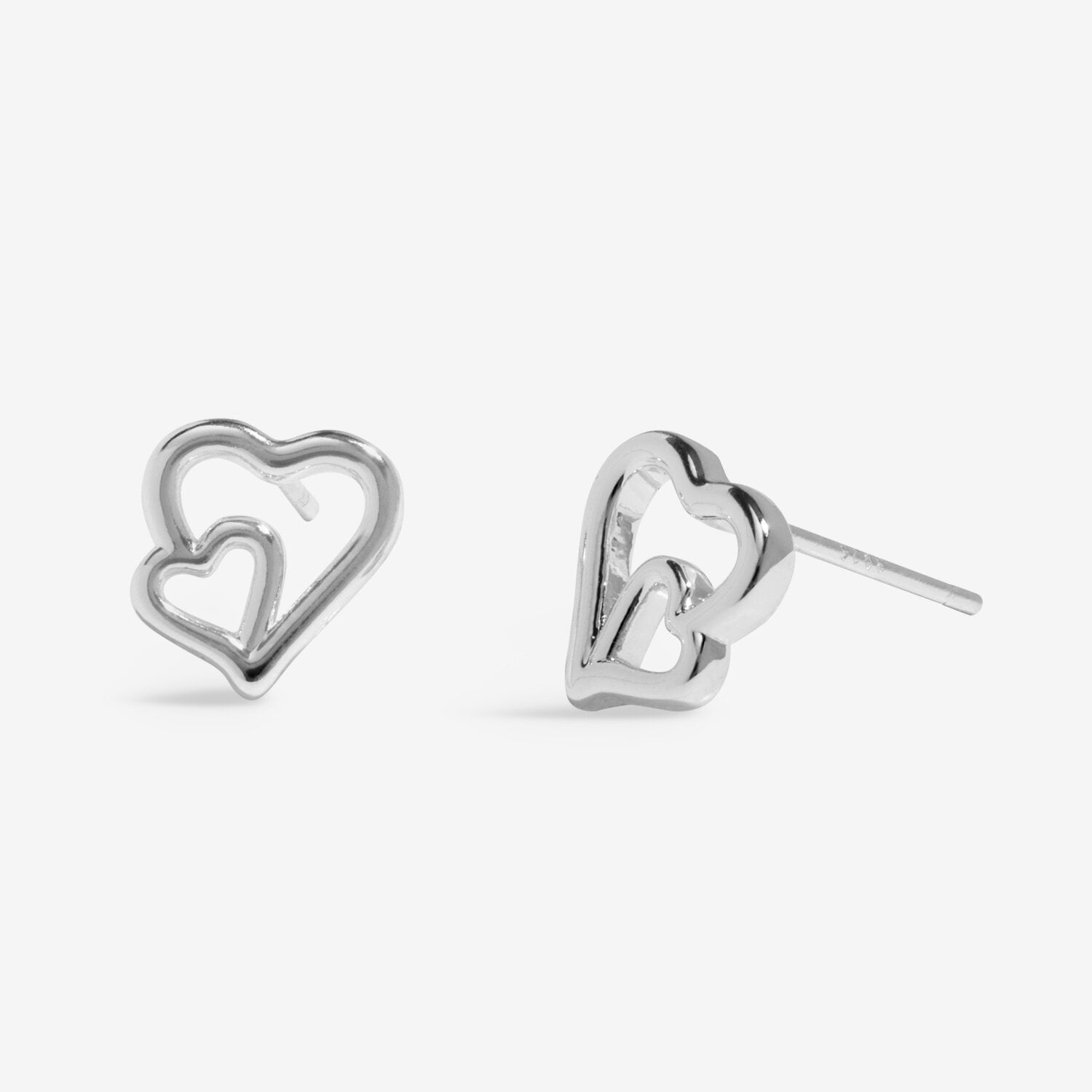 Silver heart-shaped stud earrings on a white background