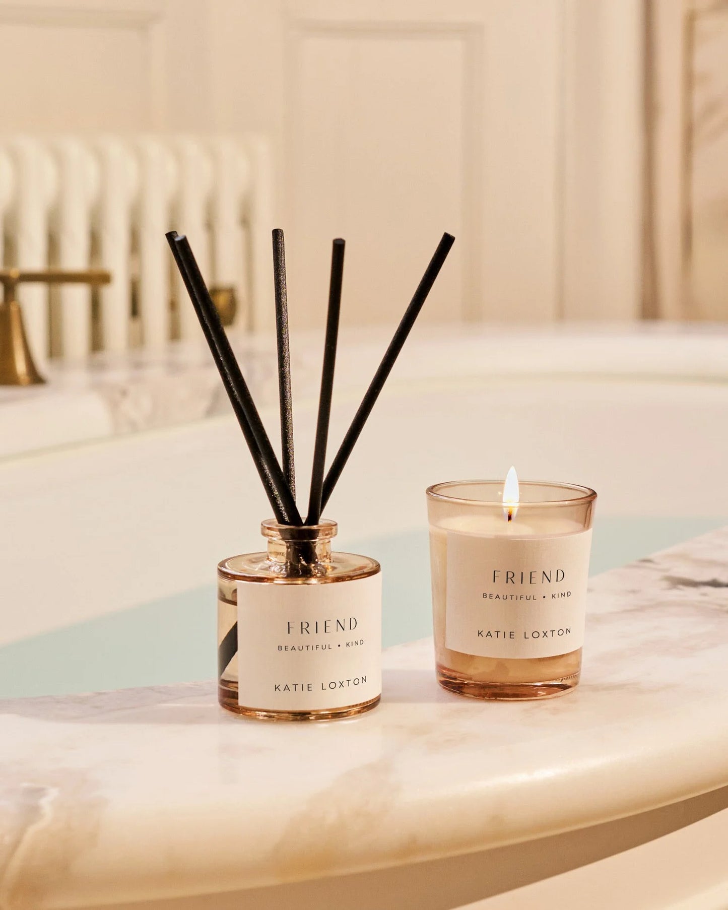 Katie Loxton 'Friend' candle and diffuser set on a marble surface with a neutral background