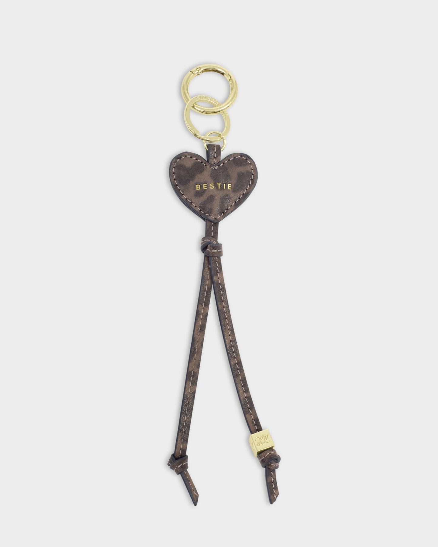 Heart-shaped keychain with a strap on a white background