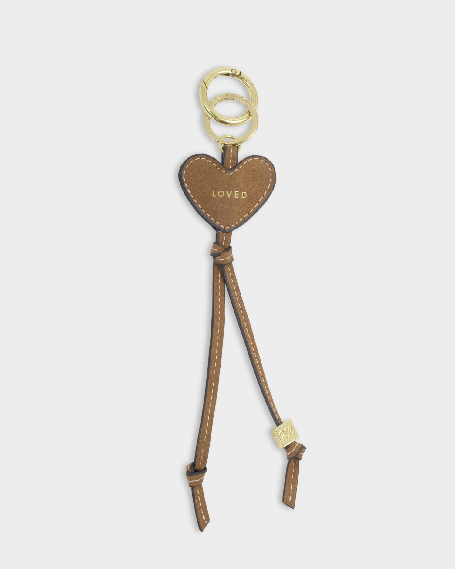 Heart-shaped keychain with 'LOVED' text on a white background
