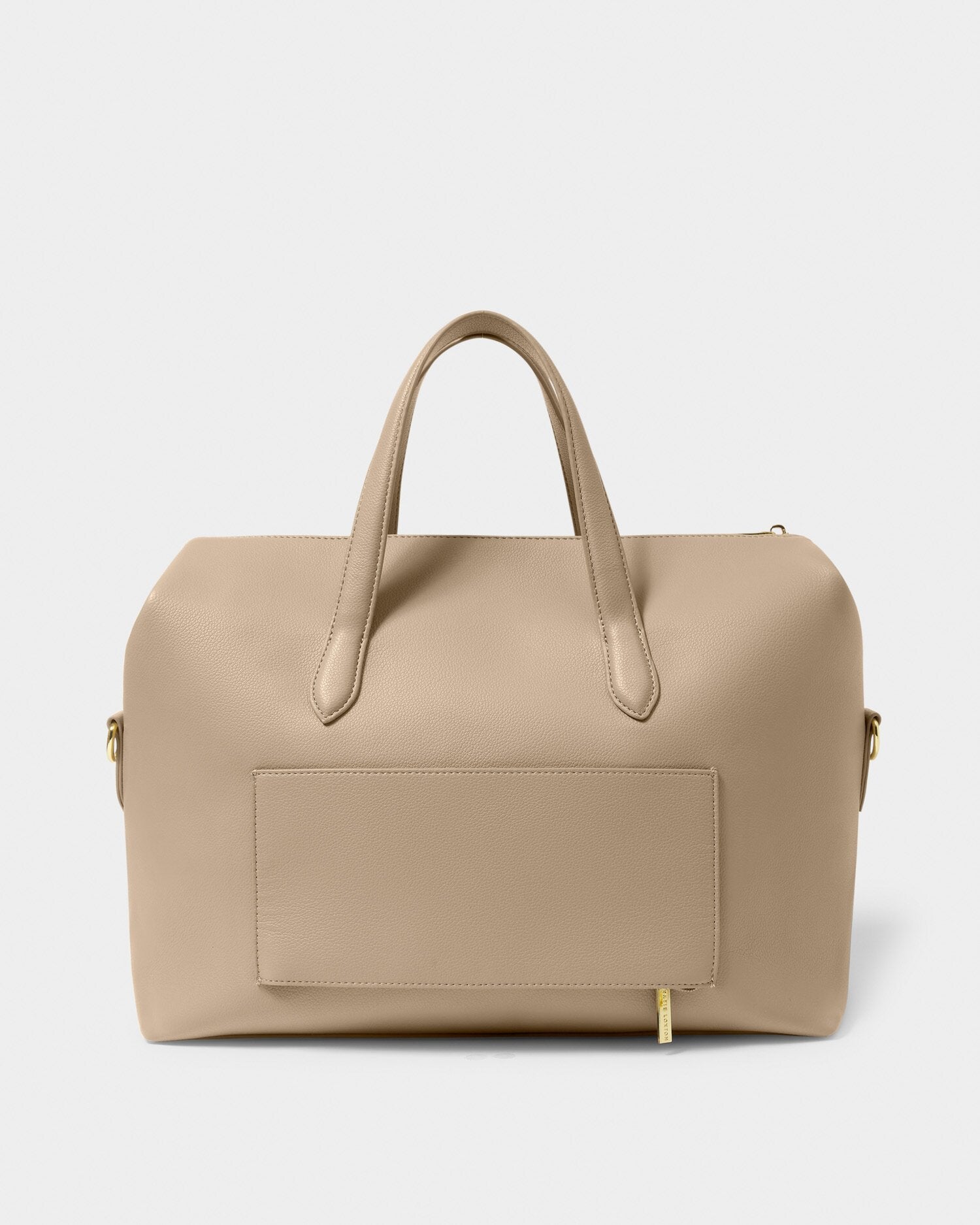 Beige handbag with a patch on a light gray background