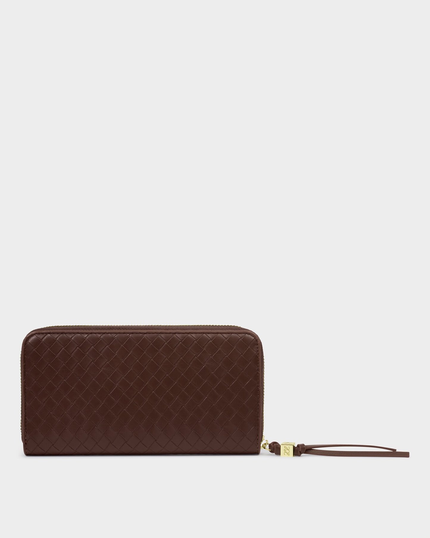 Brown quilted wallet with a strap on a light gray background