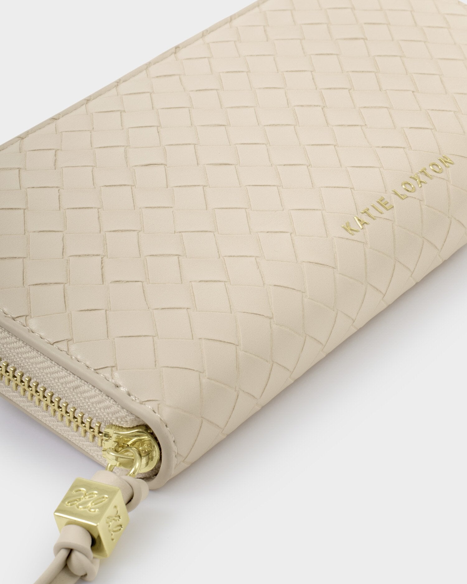 Beige woven wallet with gold zipper and logo on a white background