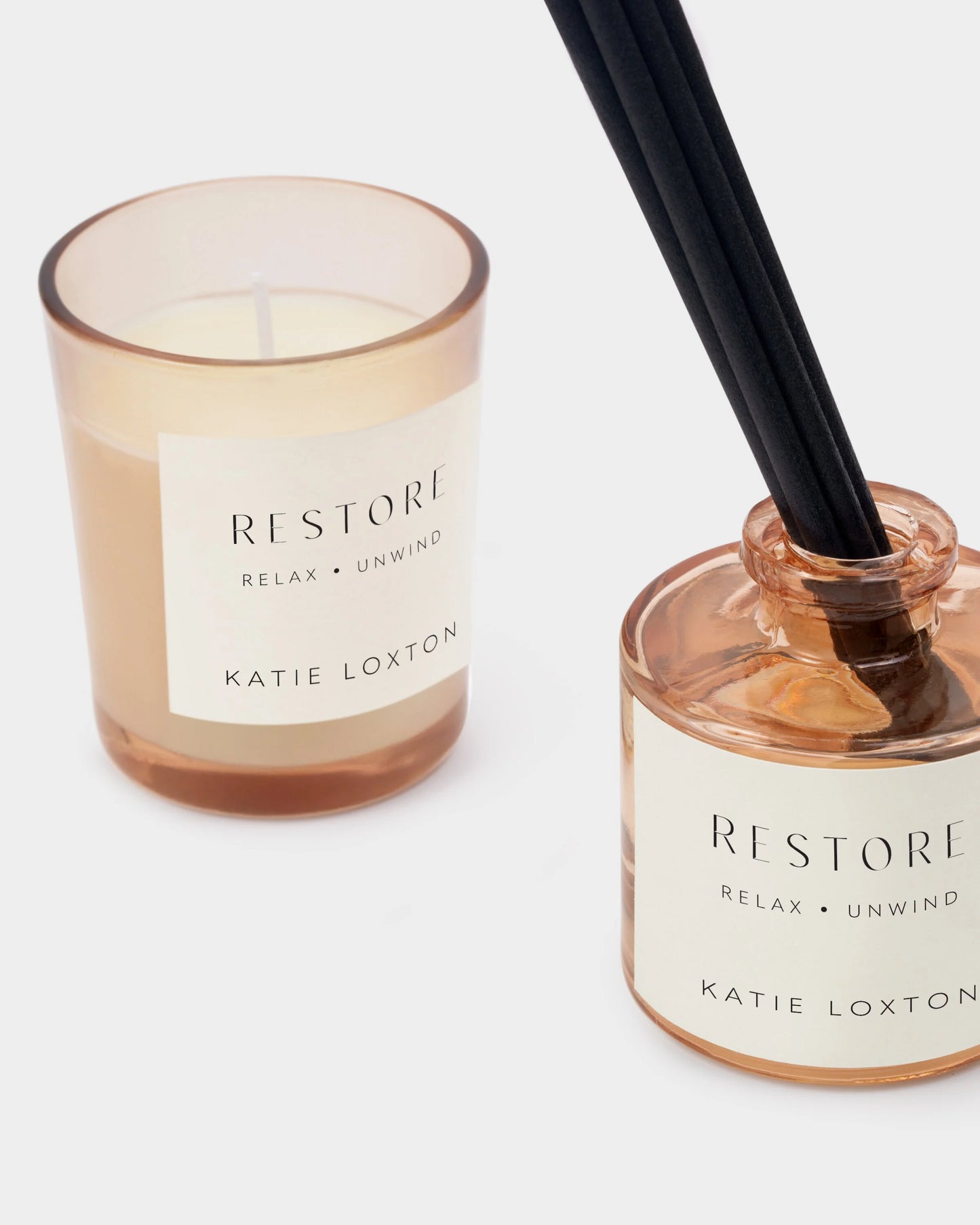 Katie Loxton 'Restore' candle and diffuser on a white background