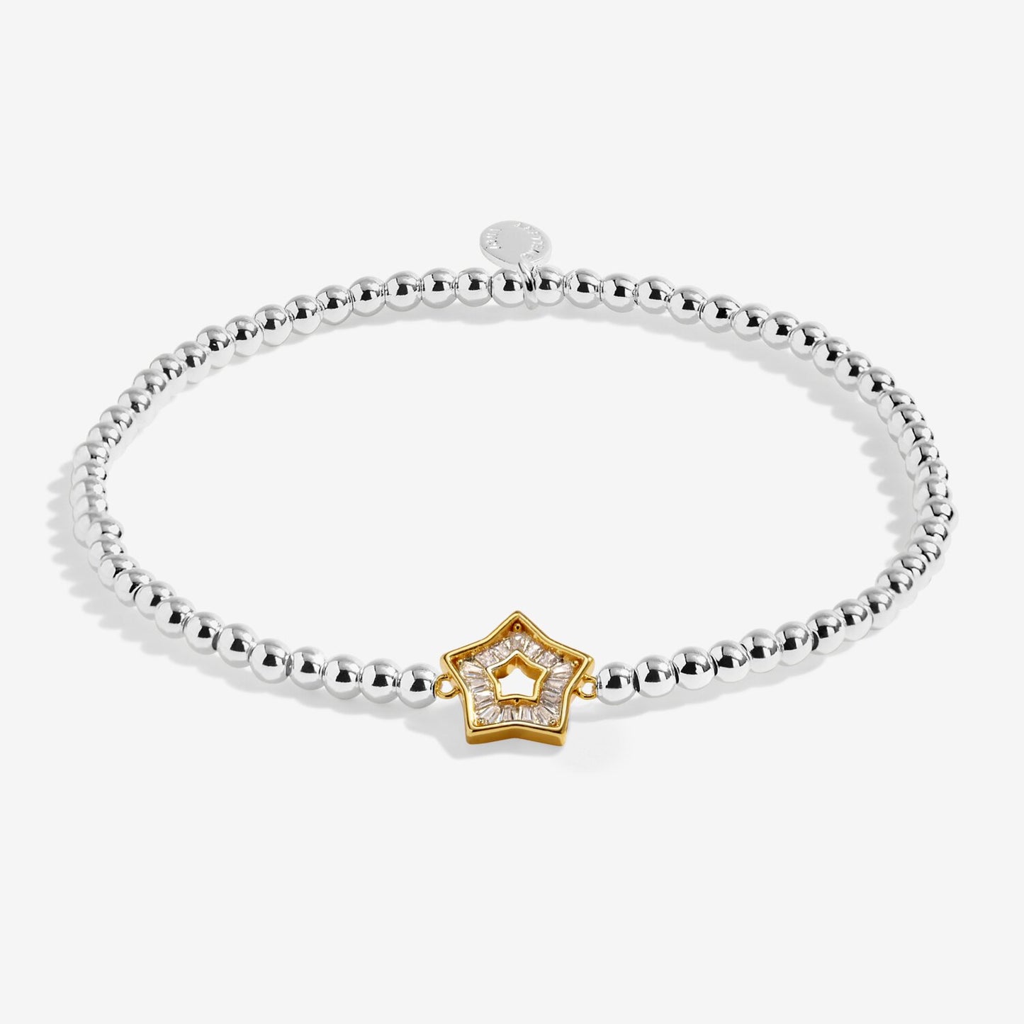 Silver bracelet with a gold star-shaped clasp on a white background