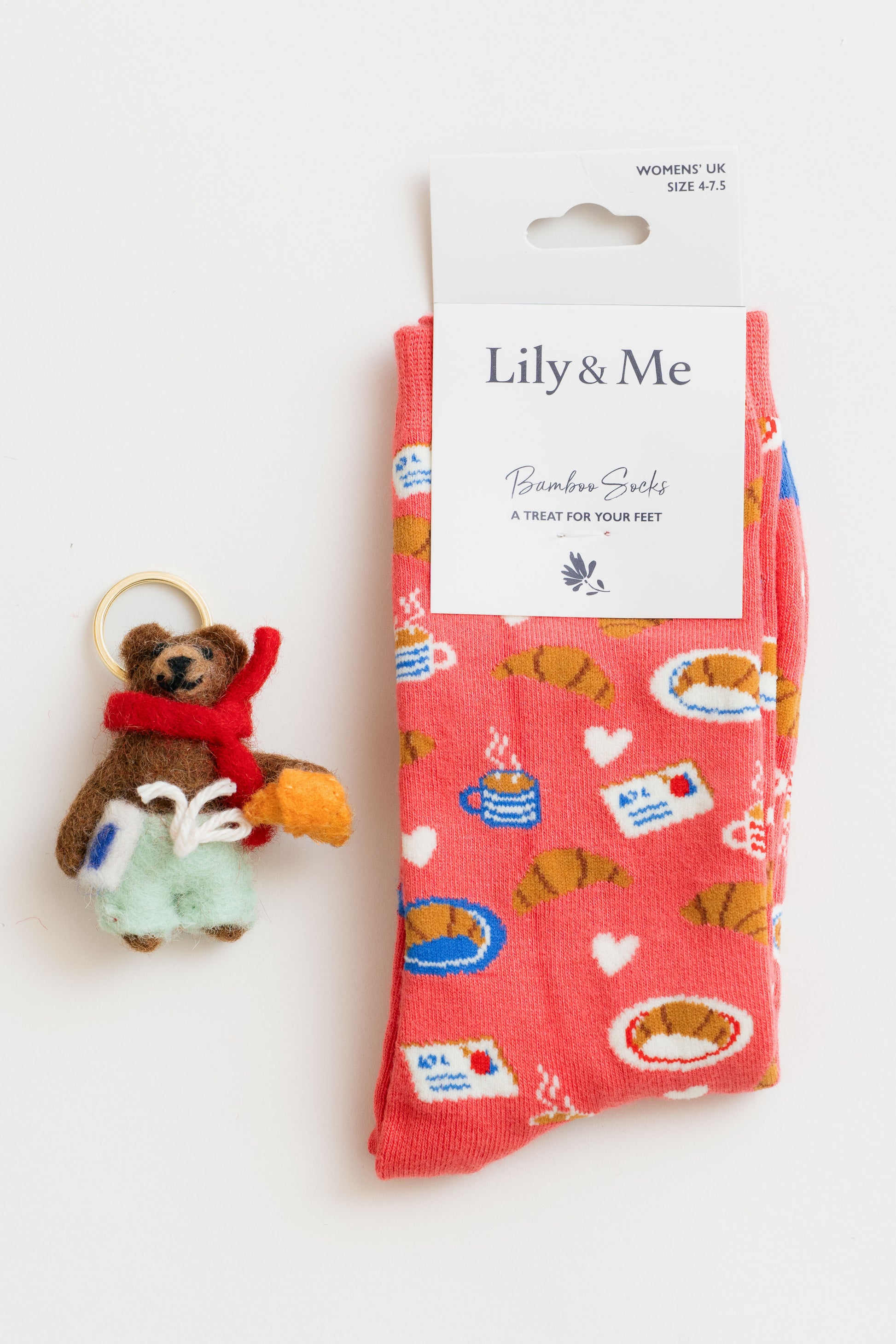 felted bear keyring alongside socks