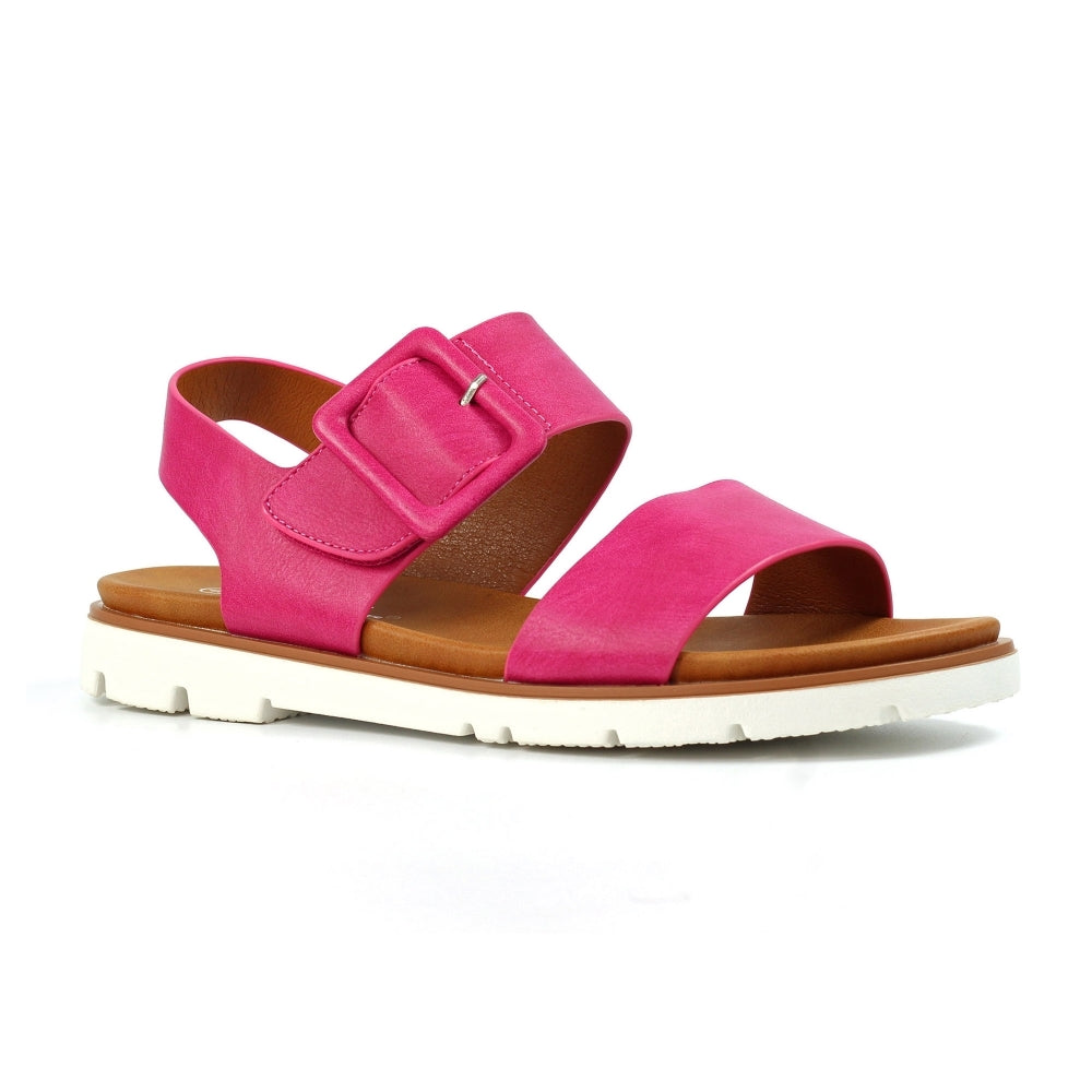Pink sandal with brown sole on a white background