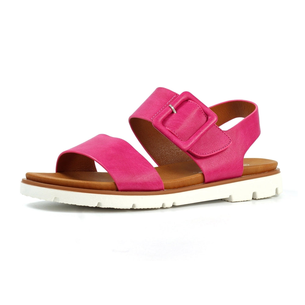 Pink sandal with brown sole on a white background