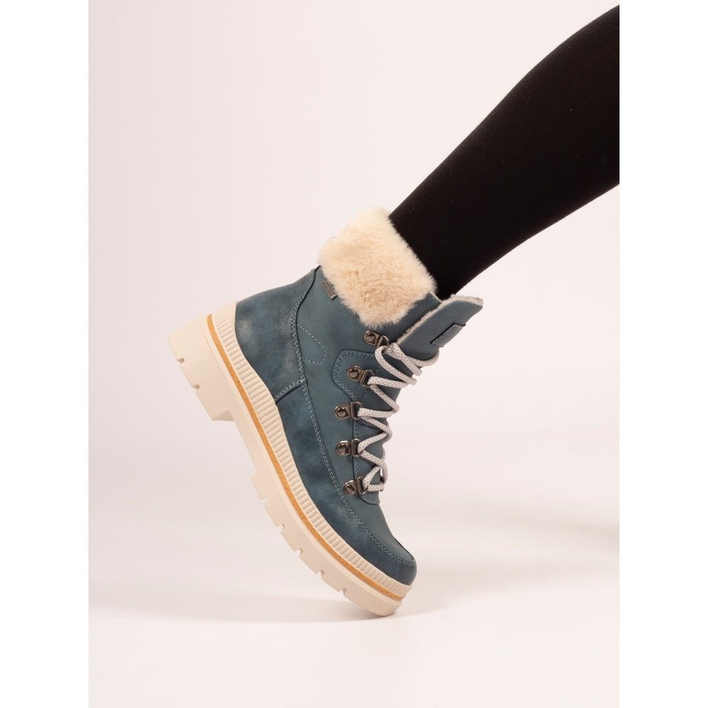 Blue winter boot with fur lining on a white background