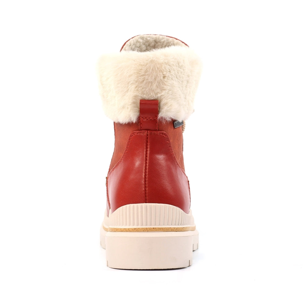Orange winter boot with white fur lining on a white background