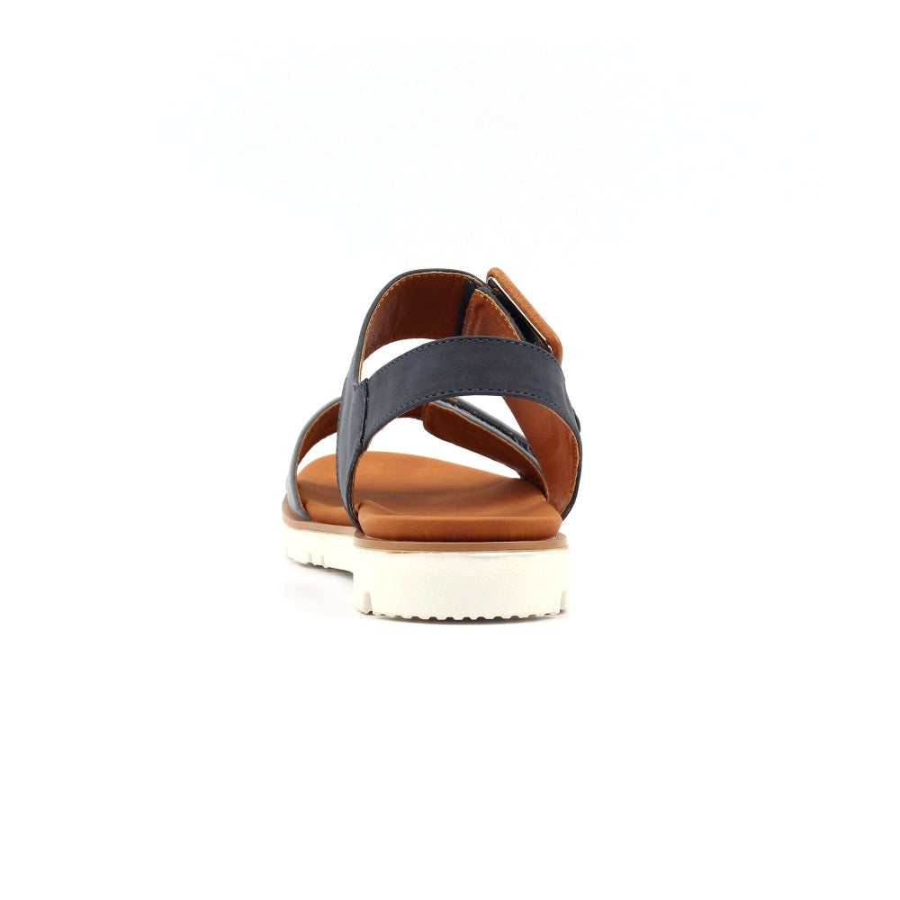 Sandal with brown sole and gray strap on a white background