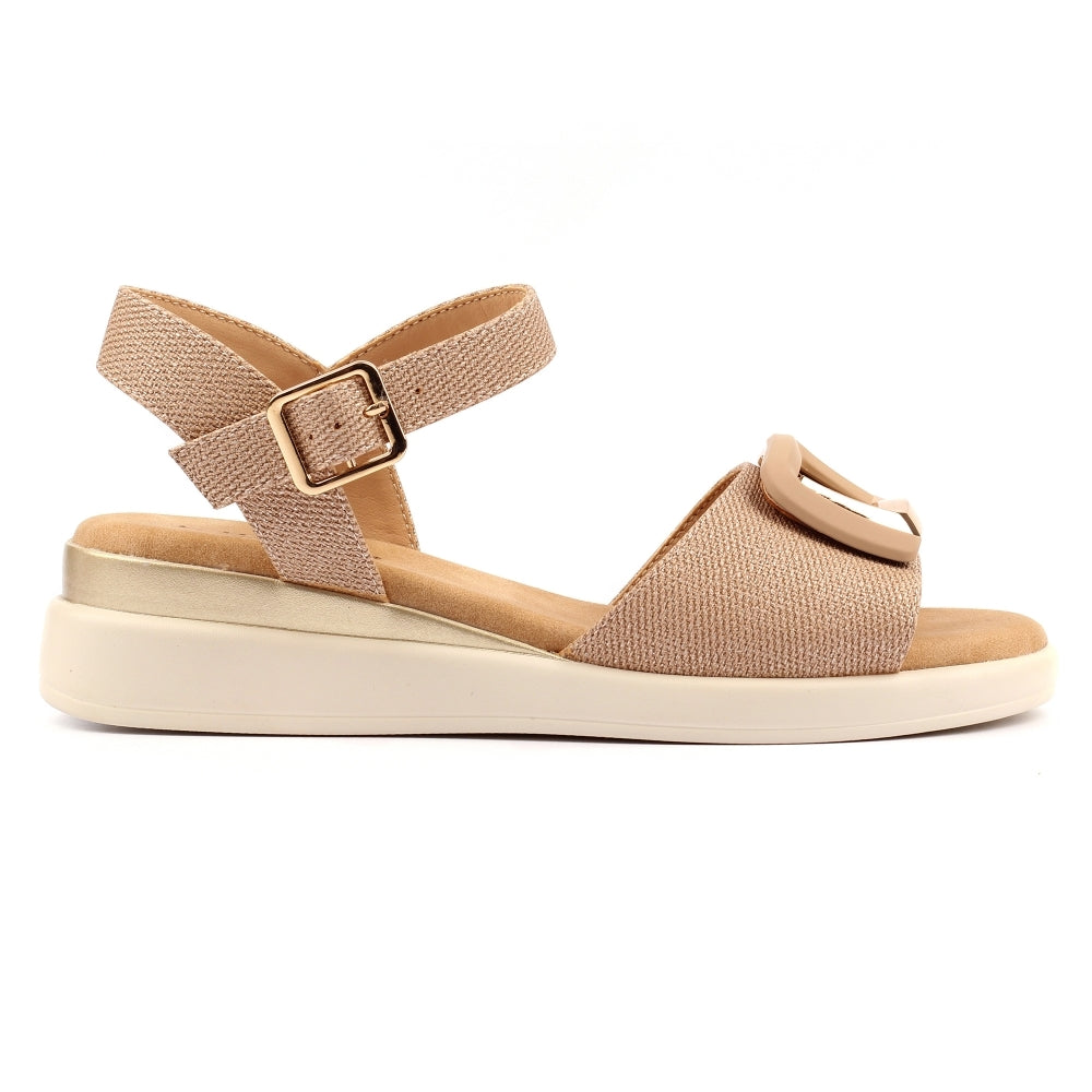 Beige sandal with a strap and buckle on a white background