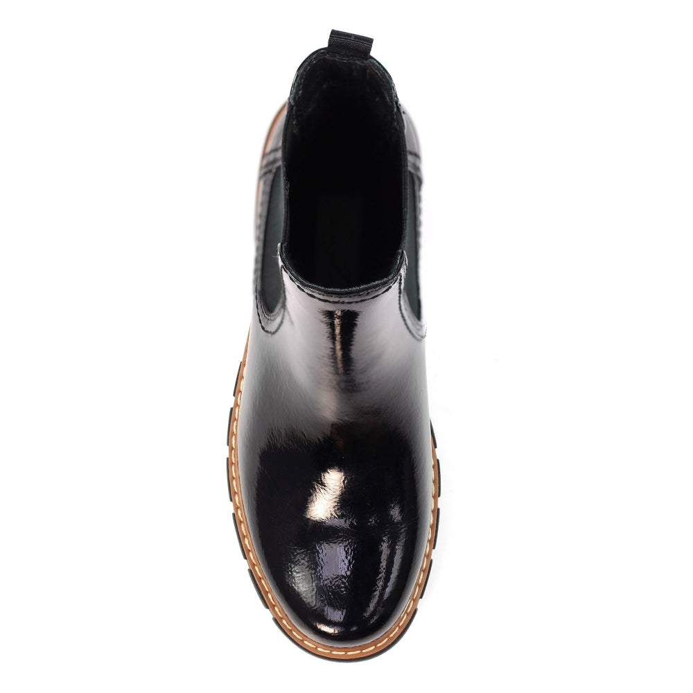 Black shiny ankle boot on a white background