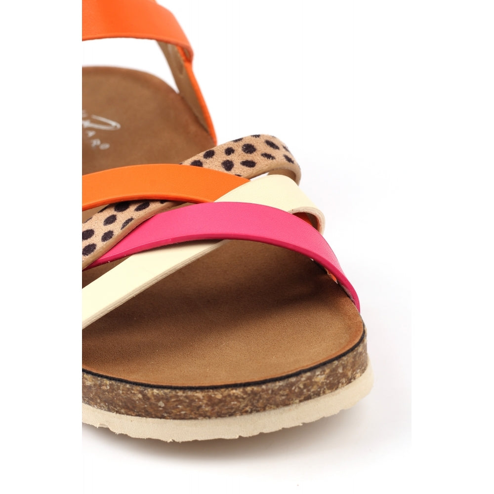 Colorful sandal with orange, pink, and leopard print straps on a white background
